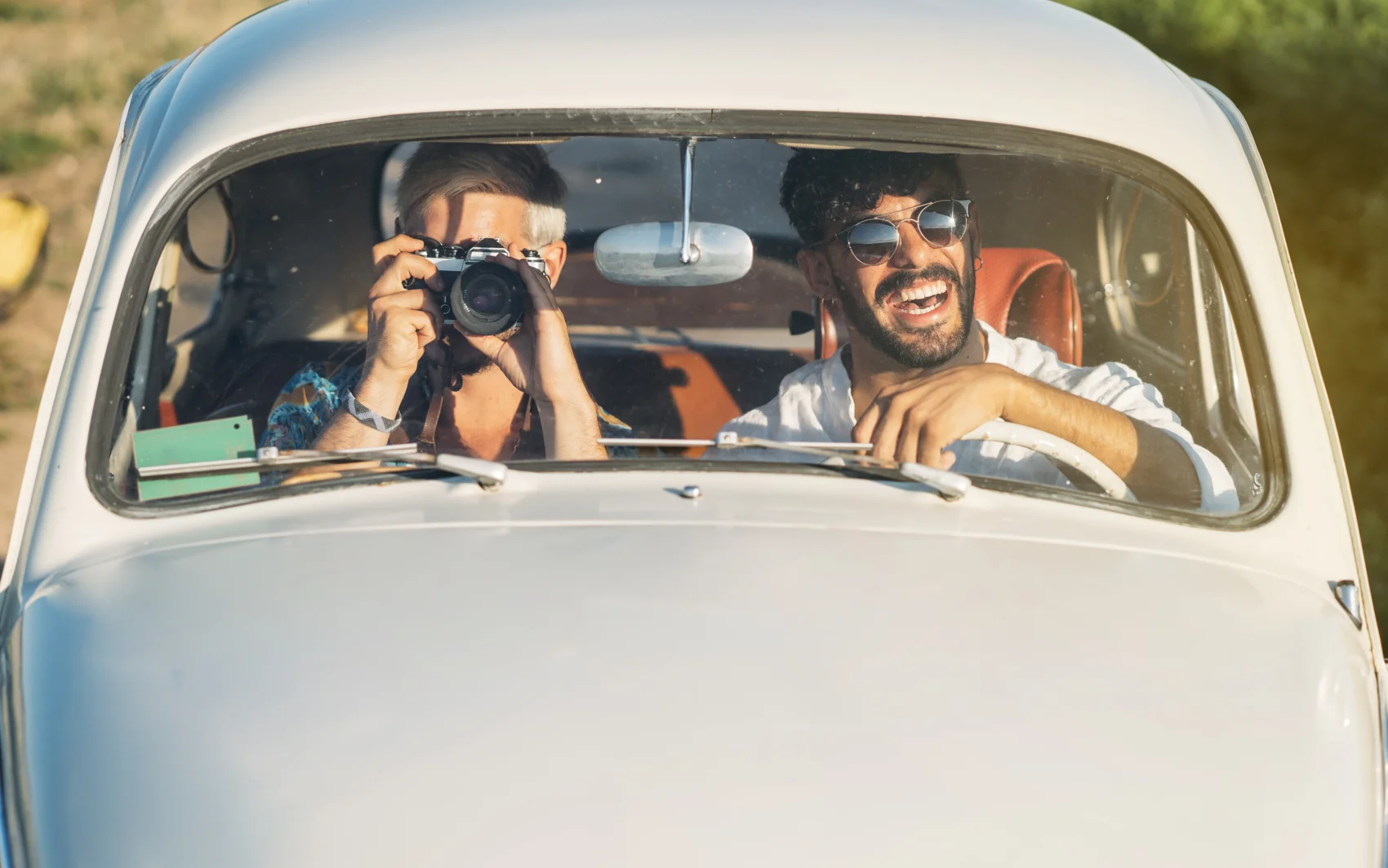 Travelers in a car being prepared for auto export overseas